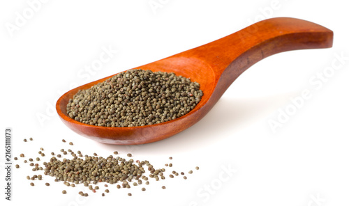 Whole raw poppy seeds isolated on white background.