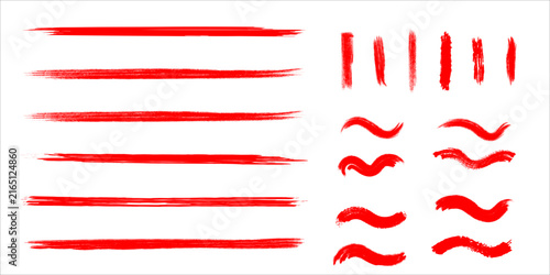 Collection of various red paint brush strokes and wavy lines isolated on a white background