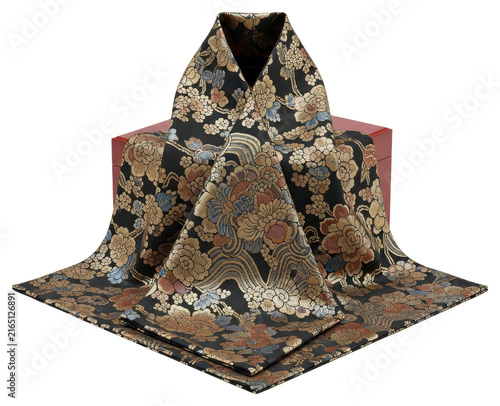 Luxurious black floral silk fabric draped over red box with transparent backdrop