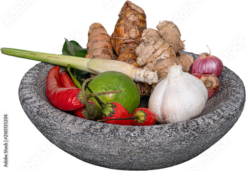 Fotografie Raw soto ayam ingredients red chilies lemongrass green lime garlic ginger in sto