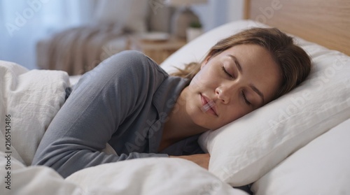 Peaceful Woman Sleeping in Bed Using Mouth Tape to Promote Nasal Breathing and Better Sleep