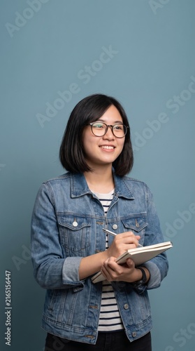 young asian student blue background