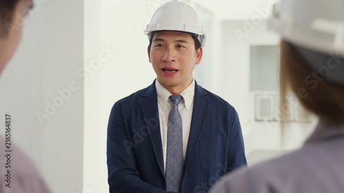 Construction inspector helmet safety business professional teamwork meeting engineer handshake office project collaboration communication leadership planning discussion building development industry