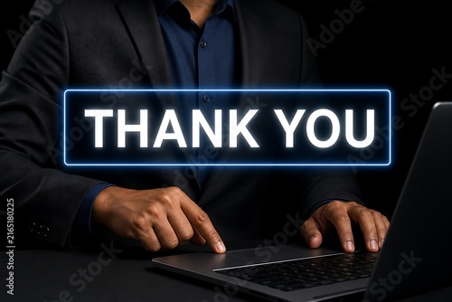 Person typing on laptop with glowing thank you text overlay