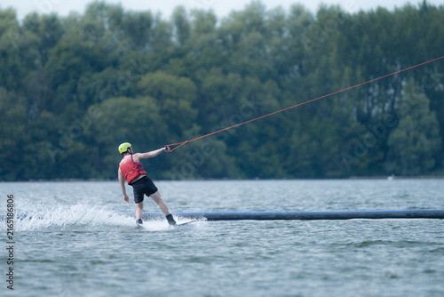 Wake boarder Riding Through Water with Dynamic Splash