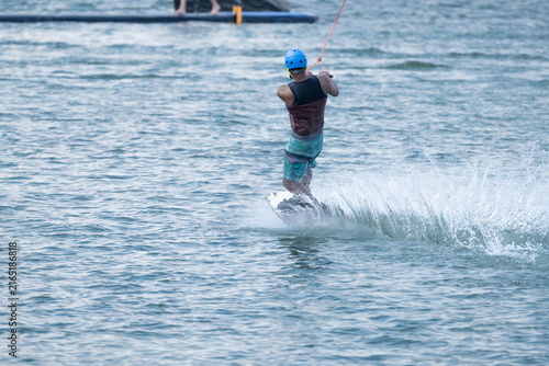 Wake boarder Riding Through Water with Dynamic Splash