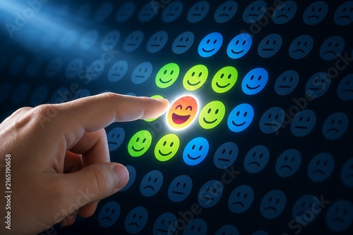 Human finger touching glowing happy smiley face icon on digital interface