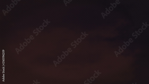 Abstract atmospheric texture of darkened clouds or smoke swirling subtly in deep shadow creating a moody and mysterious diffused light effect with subtle color variations perfect for dramatic