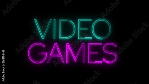 Video games neon sign glowing bright and flickering on black background.