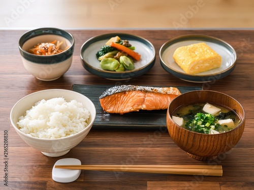 japanese breakfast set with grilled salmon, rice, dashimaki, natto, and miso soup