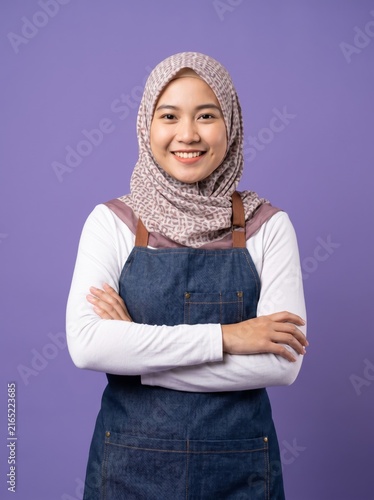 Woman wearing hijab crossing arms