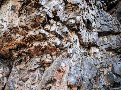 Картината върху платно Detailed close-up of rugged quartzite rock at Cernolice Rocks in Czechia, showing natural layers, cracks, colors and geological texture of the protected rock formation