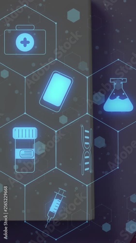 Animation of medical icons over notebook and ribbon