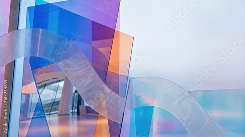 Transparent acrylic wave K with colorful blue and orange panels in modern interior design, bright and artistic atmosphere