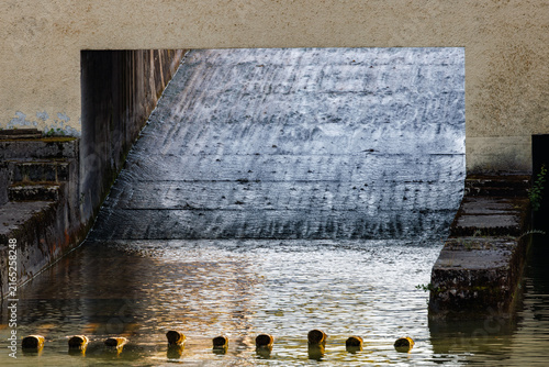 Softly blurred canal landscape along the Isar in Munich