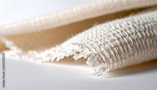 Woven Wonder: A close-up macro shot showcases the intricate texture and weave of a natural fiber fabric, highlighting its organic threads and rustic charm.