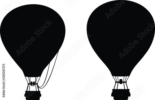 Black silhouettes of two hot air balloons flying