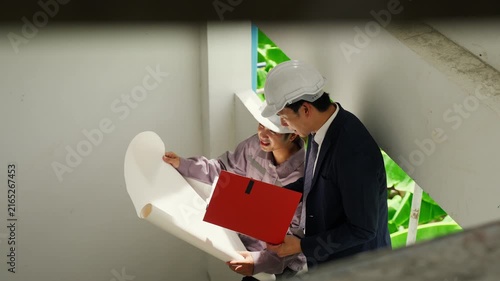 Construction inspector blueprint helmet safety teamwork planning architecture building project engineer professional discussion collaboration site office design structure development business