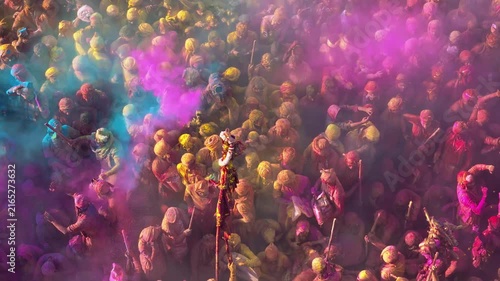 Aerial View of Holi Festival at a Sacred Indian Temple with Colorful Gulal Covering the Crowd, Traditional Religious Celebration and Vibrant Cultural Heritage