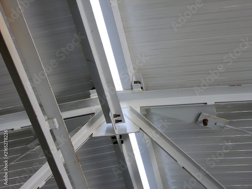Industrial warehouse ceiling structure with sandwich panels and lighting