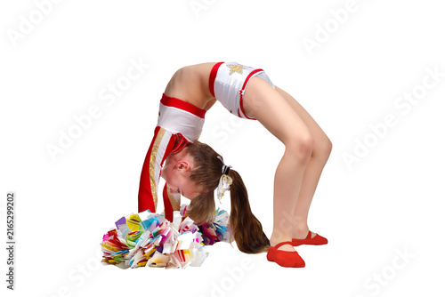 A cheerleader girl with pom-poms dances and does a bridge