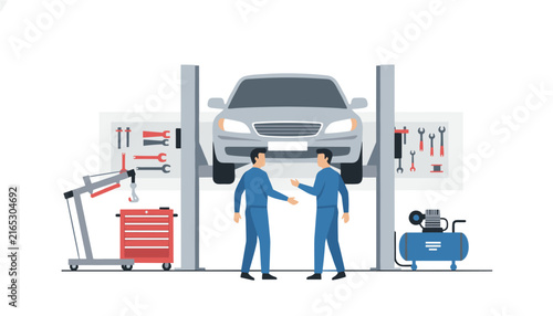 Two professional auto mechanics in blue uniforms stand in a repair shop discussing vehicle maintenance with a car raised on a hydraulic lift.