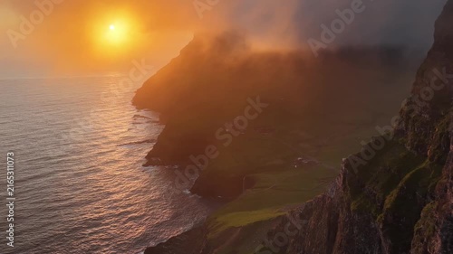 Dramatic Sunset View over Gasadalur Village and Cliffs in Faroe Islands