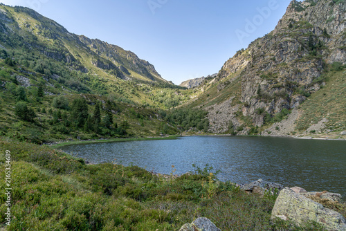 Etang de Comte Mountain Lake in Pyrenees Mountains Ariege France, Scenic Glacial Water, Steep Rocky Slopes, High Altitude Valley View