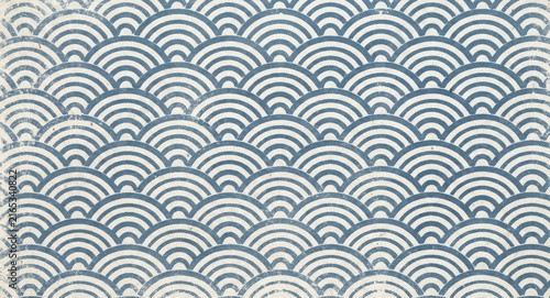 Traditional japanese seigaiha wave pattern background in blue and white with a textured paper effect