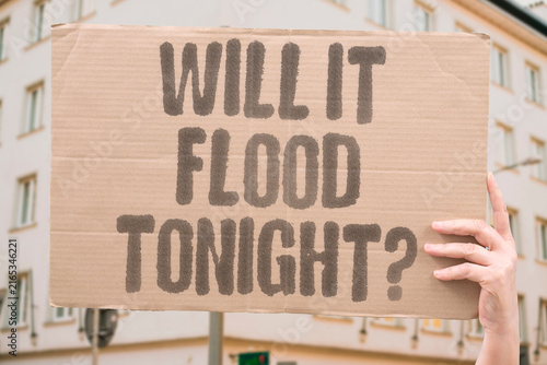 Canvastavla "Will it flood tonight?" Locals check forecasts before a storm