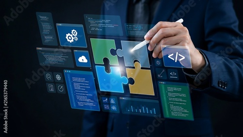 A professional business person managing software development projects using digital puzzle interfaces and data analytics icons for technological innovation