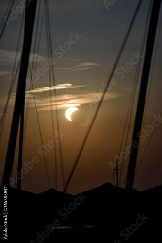 Eclipse Over Silhouetted seascape 