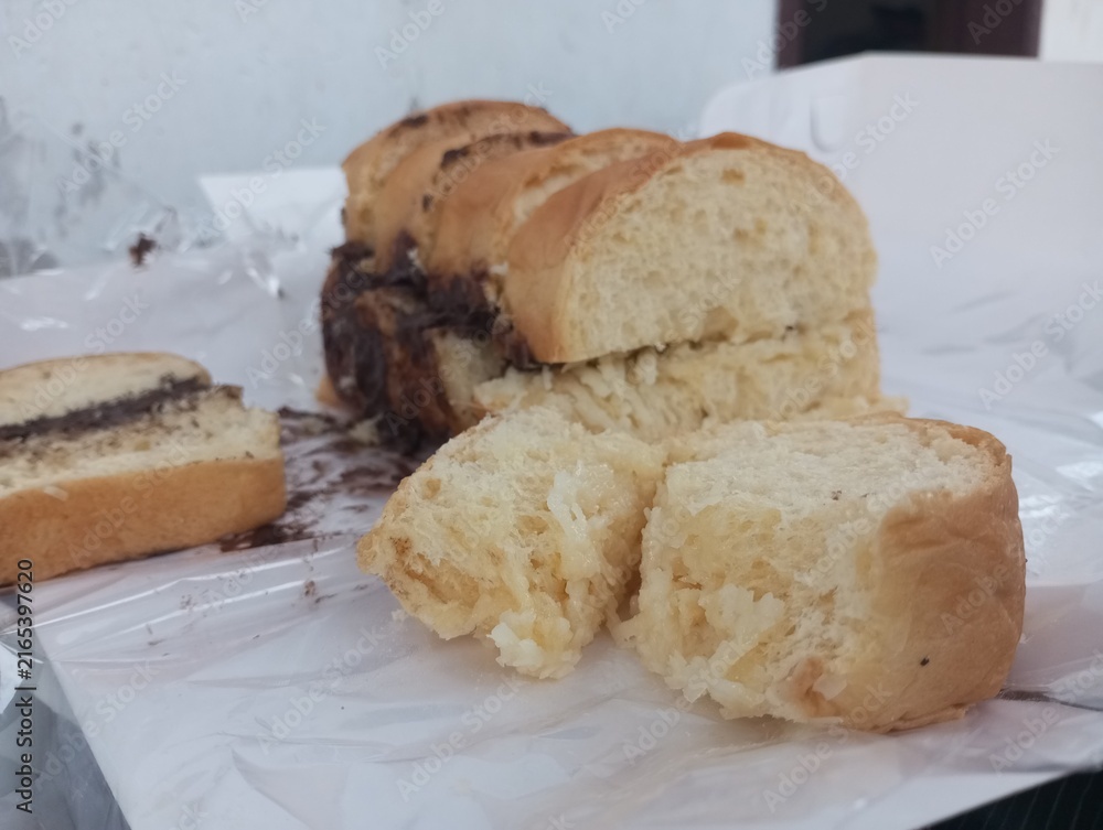 Fototapeta premium Sliced ​​bread filled with chocolate and cheese