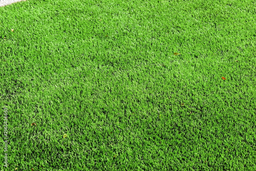 Fototapeta premium close up of clean green synthetic grass lawn surface