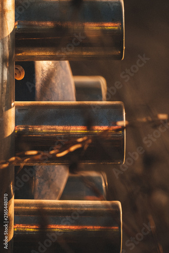 Industrial Steel Pipes Reflecting Golden Hour Sunset Light