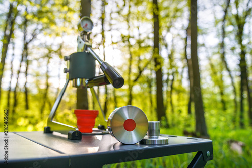 Portable manual espresso maker for outdoor coffee brewing and camping in a forest