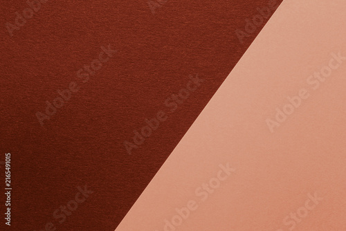 Foto close up of two sheets of cardstock with contrasting colors and textures
