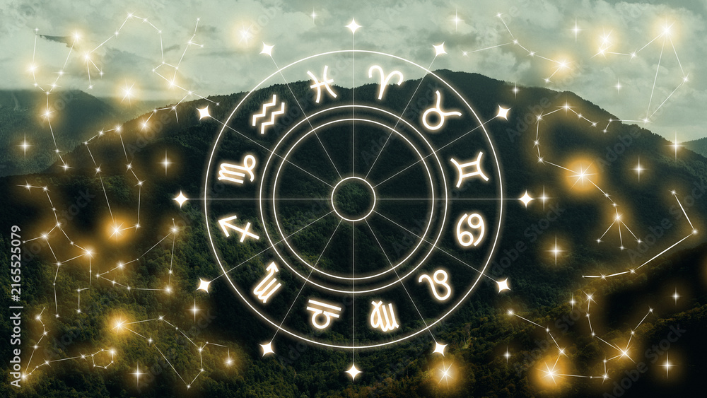 Naklejka premium Astrology zodiac signs display with constellations over a mountain background during daytime