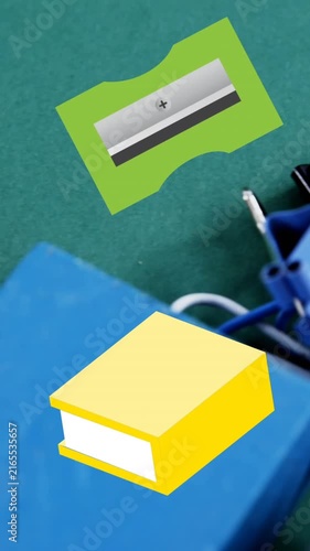 Animation of green pencil sharpeners and yellow books moving over assorted school stationery