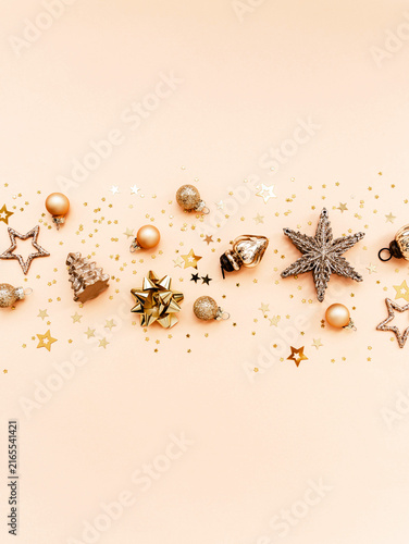 Golden Christmas Decorations on beige Background