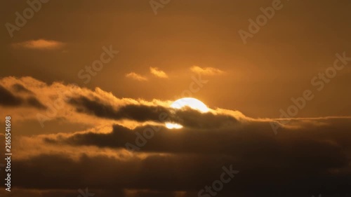 a high quality stock video about Sun disappearing behind clouds