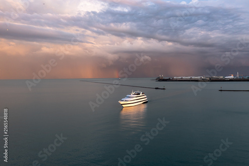 Passenger Boat on Lake Michigan Beneath Dramatic Storm Clouds