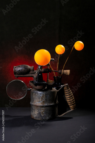 Bild auf Leinwand Still life with an old blowtorch and orange balls