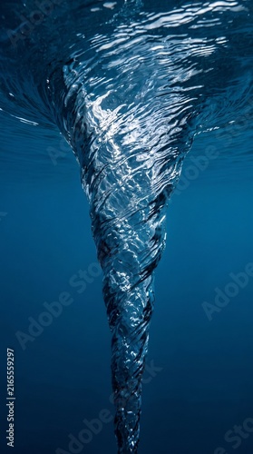 Underwater blue water vortex tornado swirl spiral abstract ocean background