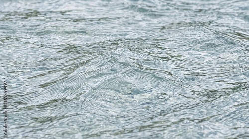 Clear rippling water surface texture with gentle waves and light reflections