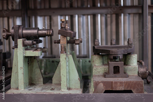 Fotografie Industrial metalworking machinery and tooling fixture in tractor factory workshop