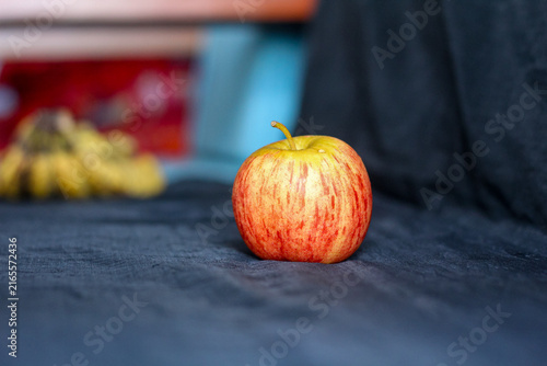 Single Red Gala Apple On Dark Fabric