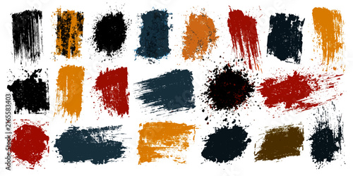 A collection of colorful paint strokes and splatters create abstract artistic textures in a vibrant array of earthy tones.