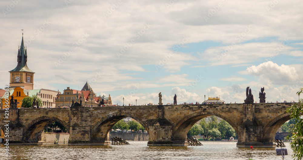 Fototapeta premium Charles Bridge in Prague, Czech Republic with historic towers and river view