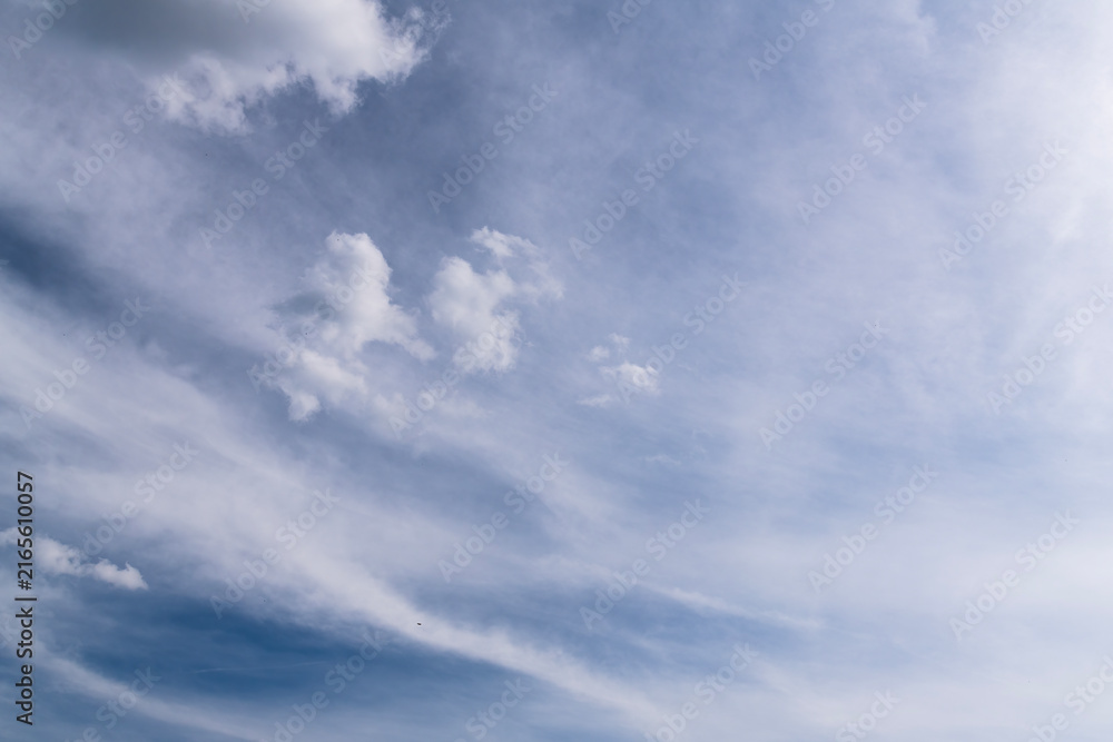 Obraz premium Blue sky with delicate cirrus clouds background on a sunny day